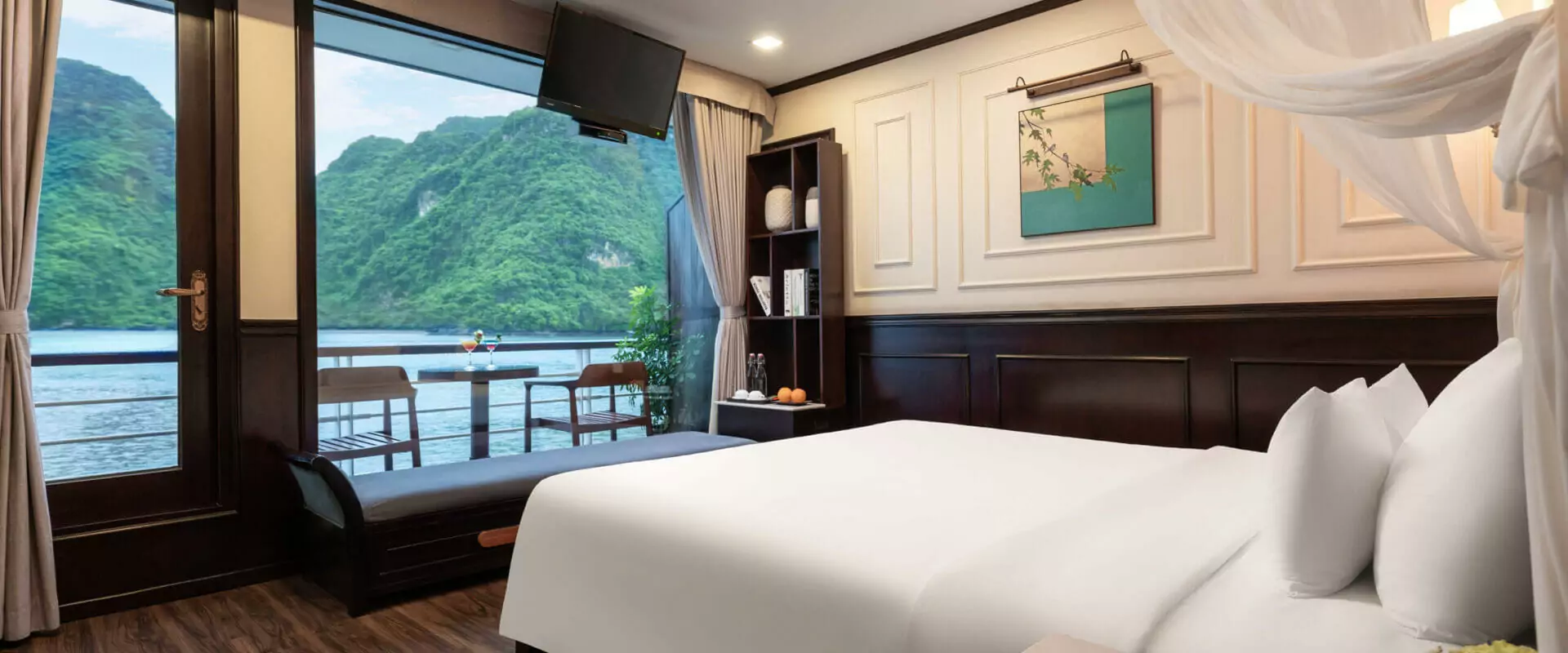 Amanda Luxury Cruise Lan Ha Bay suite with canopy bed and private balcony