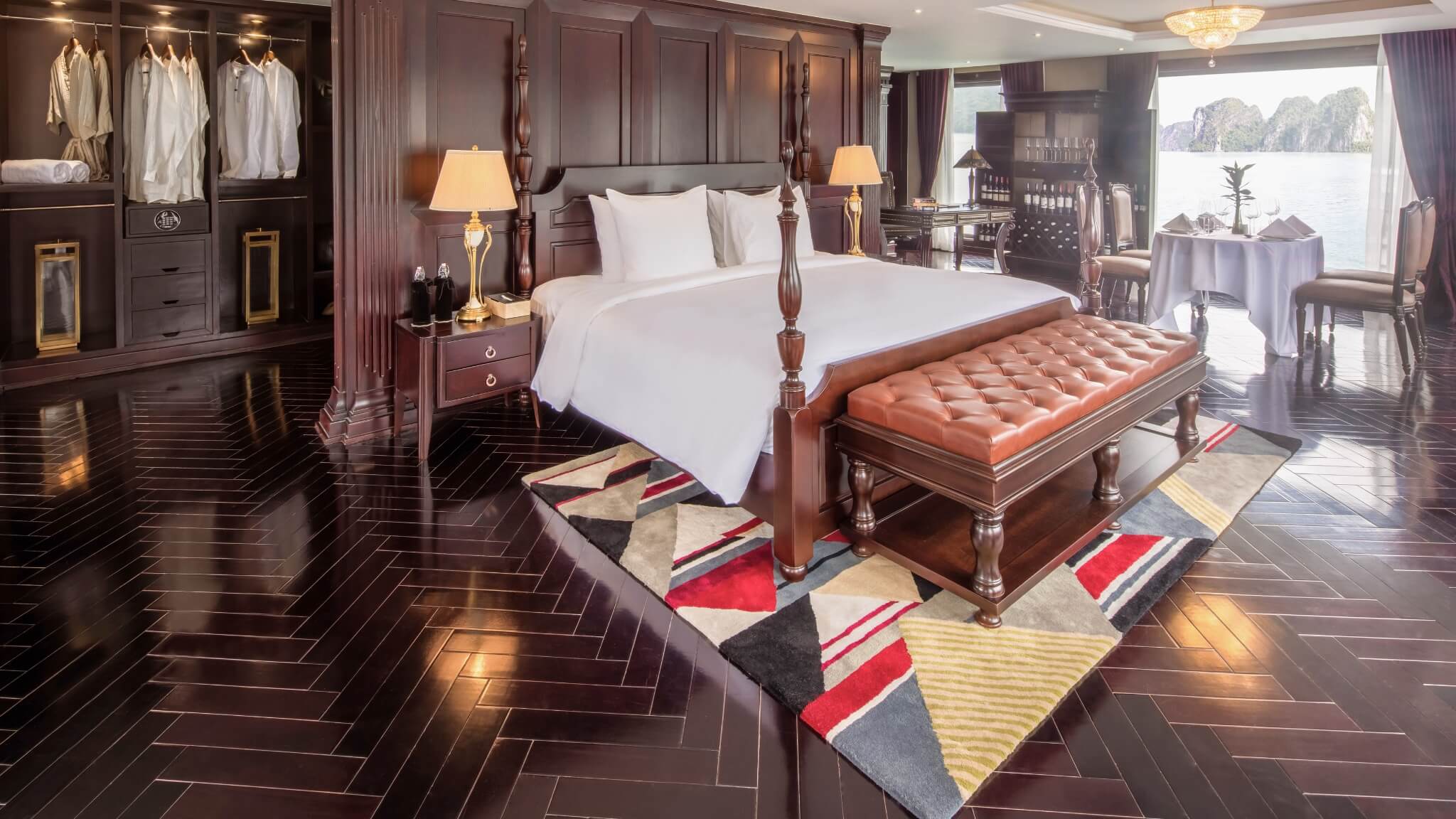 Presidential Suite bedroom on Ambassador Cruise with four-poster bed