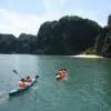 Kayaking through Ao Ech Area (Frog Pond) -- Lan Ha Bay's mirror-calm enclosed lagoon surrounded by towering limestone karsts, Vietnam