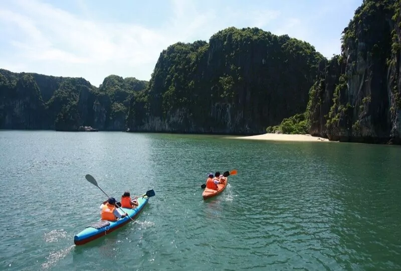 Kayaking through Ao Ech Area (Frog Pond) -- Lan Ha Bay's mirror-calm enclosed lagoon surrounded by towering limestone karsts, Vietnam