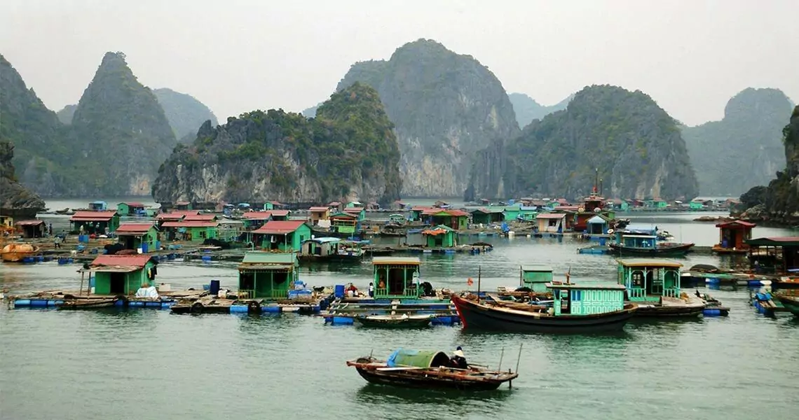 Cap La Floating Fishing Village -- one of 4 UNESCO World Heritage floating villages in the bay region, with 80 households living entirely on the water between Bai Tu Long Bay and Halong Bay