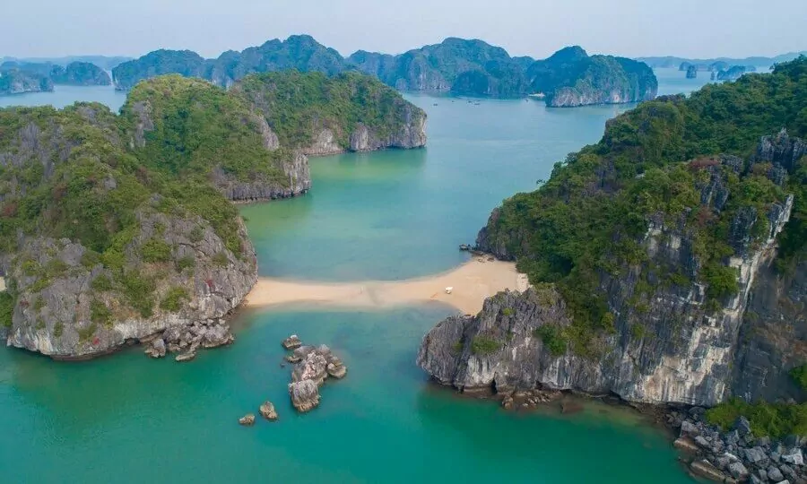 Cong Dam Area's uniquely horizontally layered limestone karst formations in Bai Tu Long Bay -- 340-million-year-old stacked rock described as an outdoor geological museum