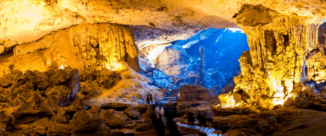 Sung Sot Cave interior — the largest cave in Halong Bay, Vietnam, with dramatic stalactites and colorful lighting