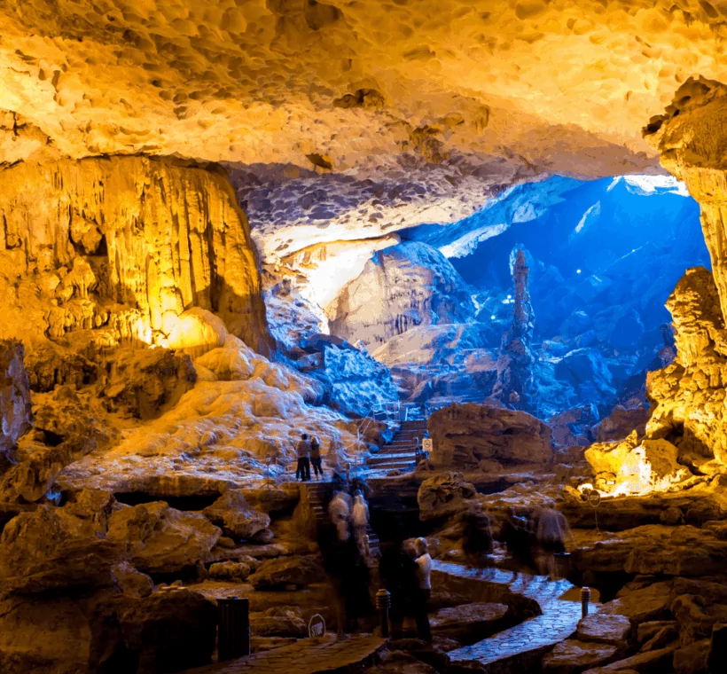 Sung Sot Cave interior — the largest cave in Halong Bay, Vietnam, with dramatic stalactites and colorful lighting