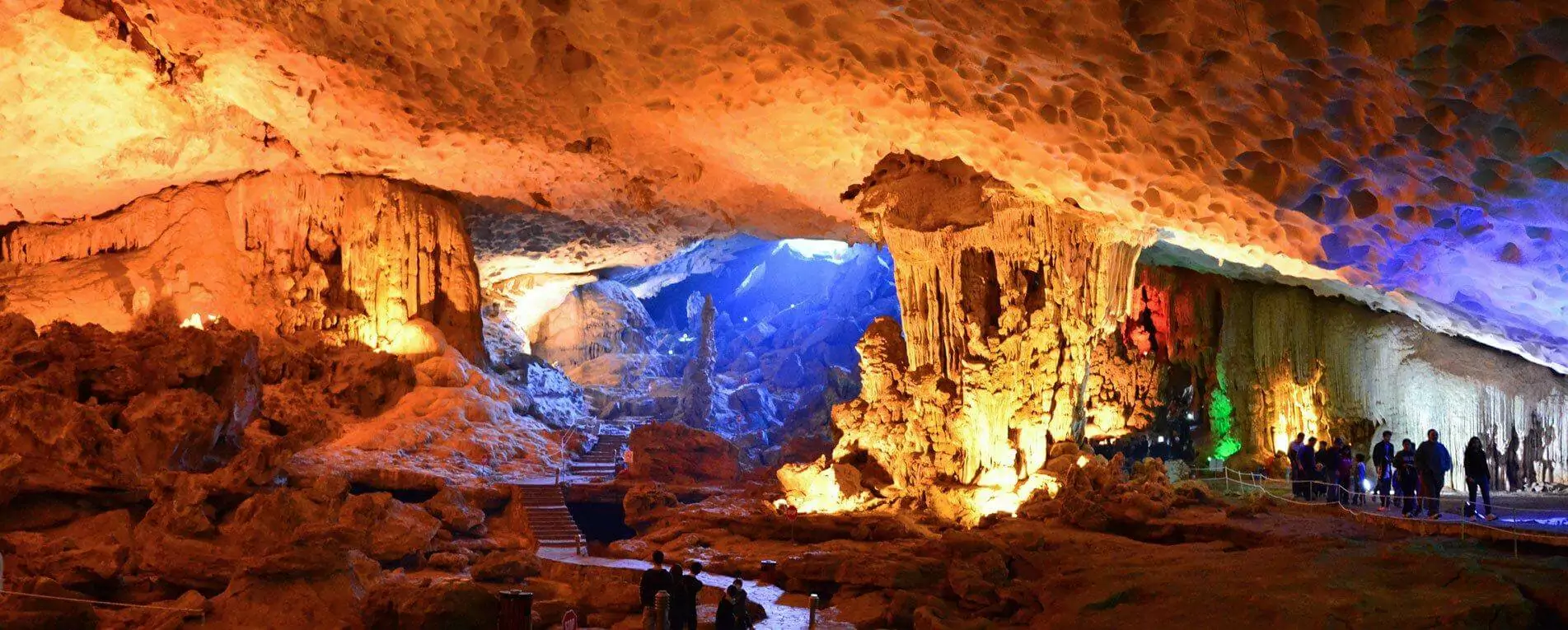 Sung Sot Cave third chamber "Royal Garden" — vast space with colorful lights, stalactites and stalagmites, Halong Bay Vietnam