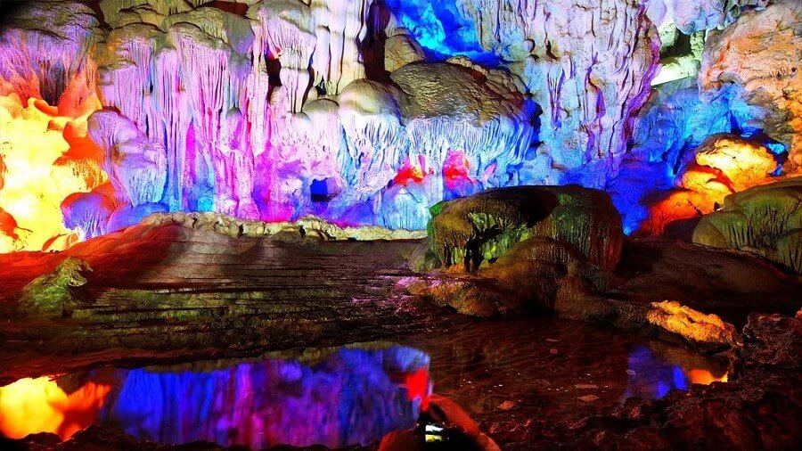 Four massive limestone pillars in Thien Cung Cave's second chamber, the heart of the Dragon King's legendary wedding hall, Halong Bay