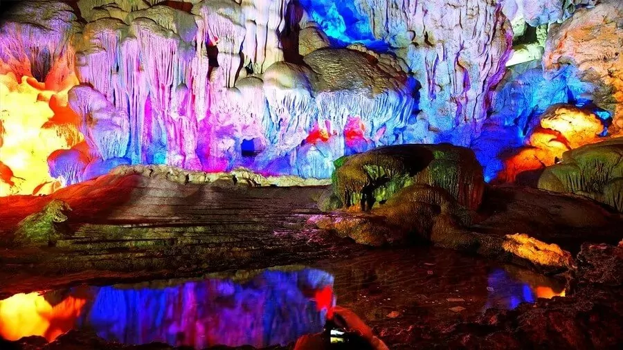 Four massive limestone pillars in Thien Cung Cave's second chamber, the heart of the Dragon King's legendary wedding hall, Halong Bay