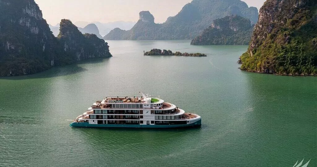 Capella Cruise sailing through Lan Ha Bay's limestone karsts, Halong Bay