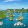 Halong Bay at sunrise during autumn, the best time to visit for clear skies and calm water