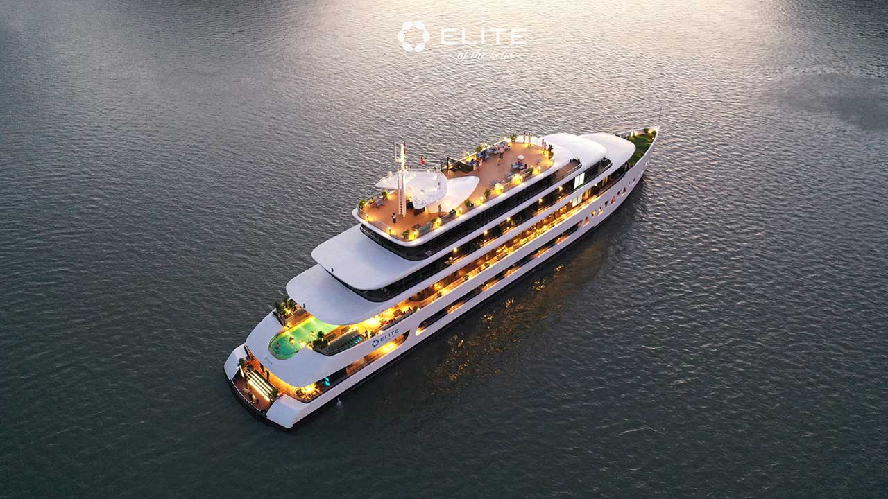 Elite of the Seas Cruise illuminated at night with glowing pool deck