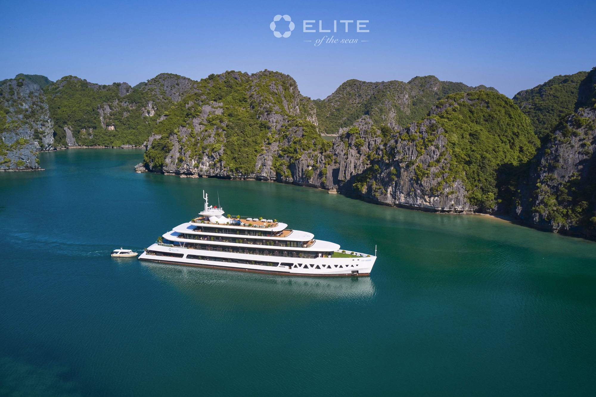 Elite of the Seas Cruise sailing through a narrow karst channel with tender boat