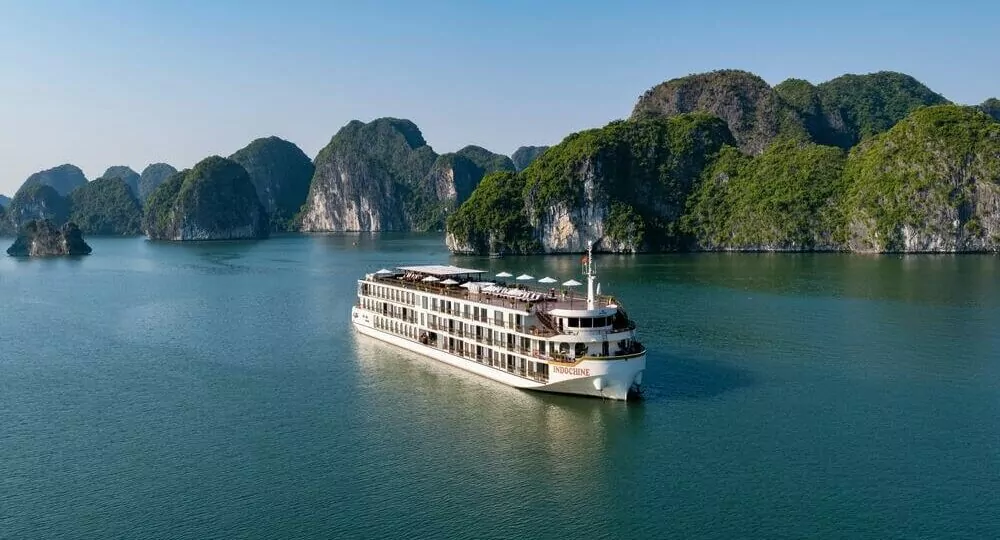 Indochine Cruise sailing through Halong Bay's limestone karsts