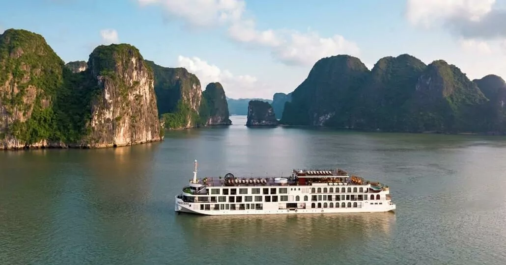 Indochine Premium Cruise sailing past Halong Bay's limestone karsts, Vietnam