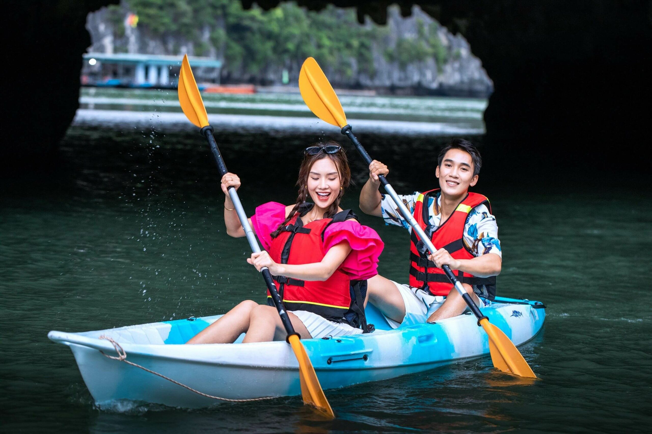 Guests kayaking at Luon Cave during Indochine Premium Cruise itinerary in Halong Bay