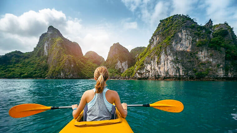Kayaking at Luon Cave during the La Casta Daily Cruise itinerary