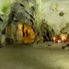 Trung Trang Cave interior — ancient stalactite formations inside a 300-meter limestone tunnel, Cat Ba Island Vietnam