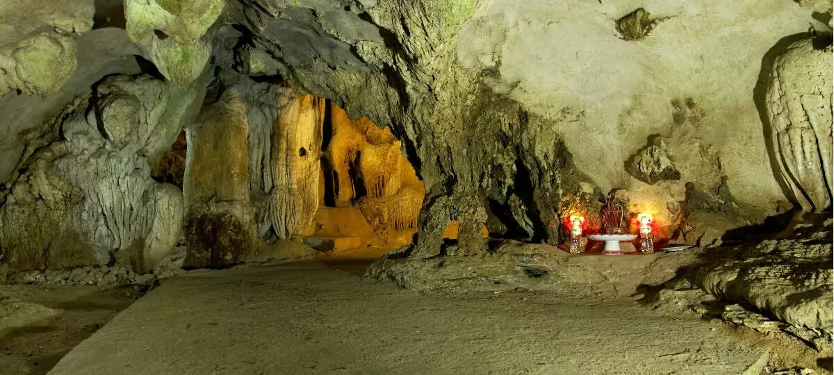 Trung Trang Cave interior — ancient stalactite formations inside a 300-meter limestone tunnel, Cat Ba Island Vietnam