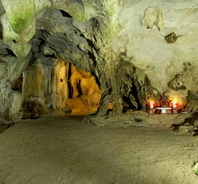 Trung Trang Cave interior — ancient stalactite formations inside a 300-meter limestone tunnel, Cat Ba Island Vietnam