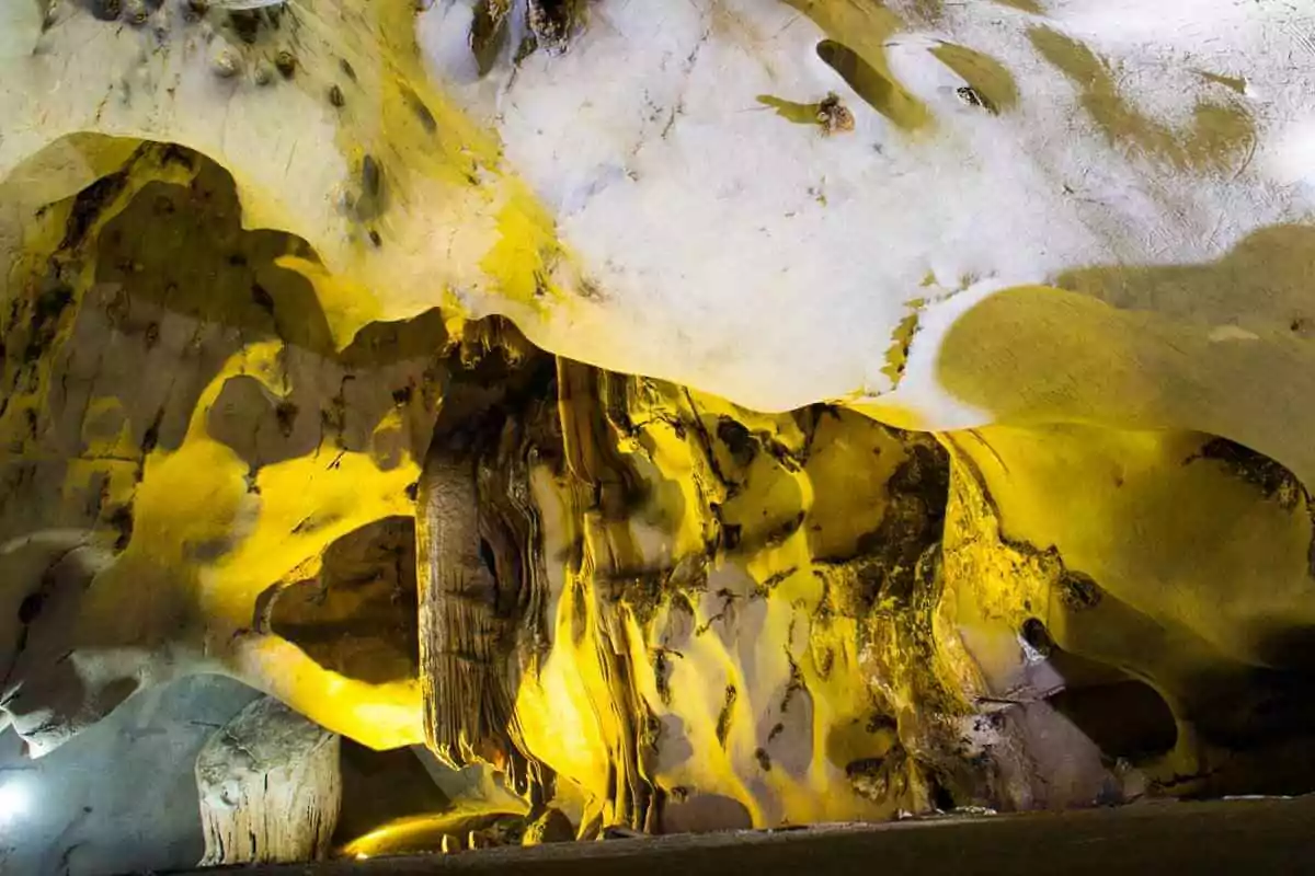 Unique stalactite and stalagmite shapes inside Trung Trang Cave, resembling natural sculptures, Cat Ba Island Vietnam