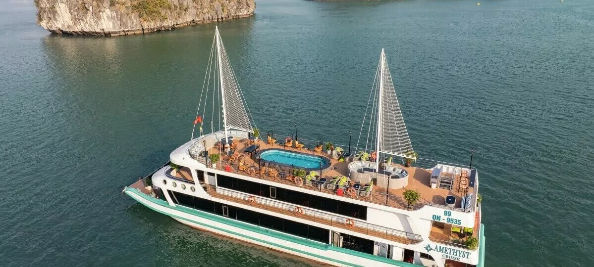 Amethyst Day Cruise aerial view sailing through Halong Bay limestone karsts