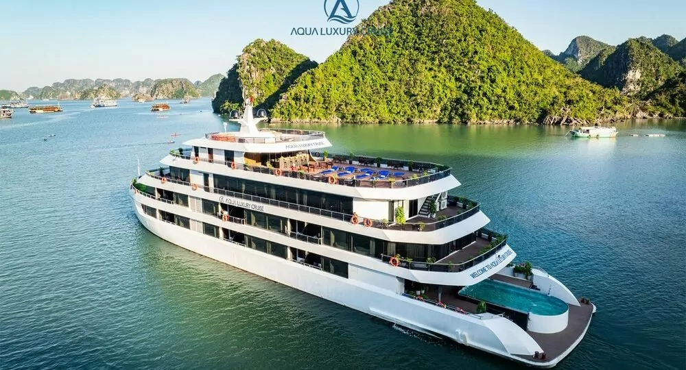 Aqua Luxury Cruise Halong Bay sailing past limestone karsts