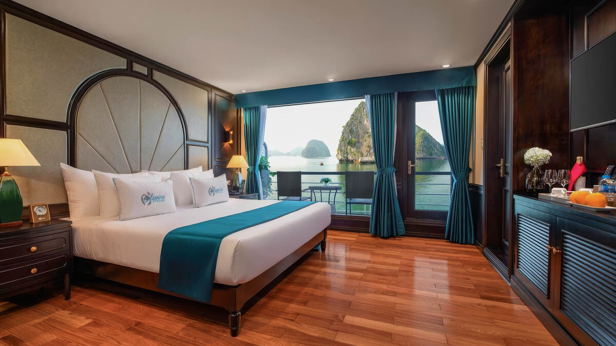 Aspira Cruise Junior Suite bedroom with private balcony over Lan Ha Bay