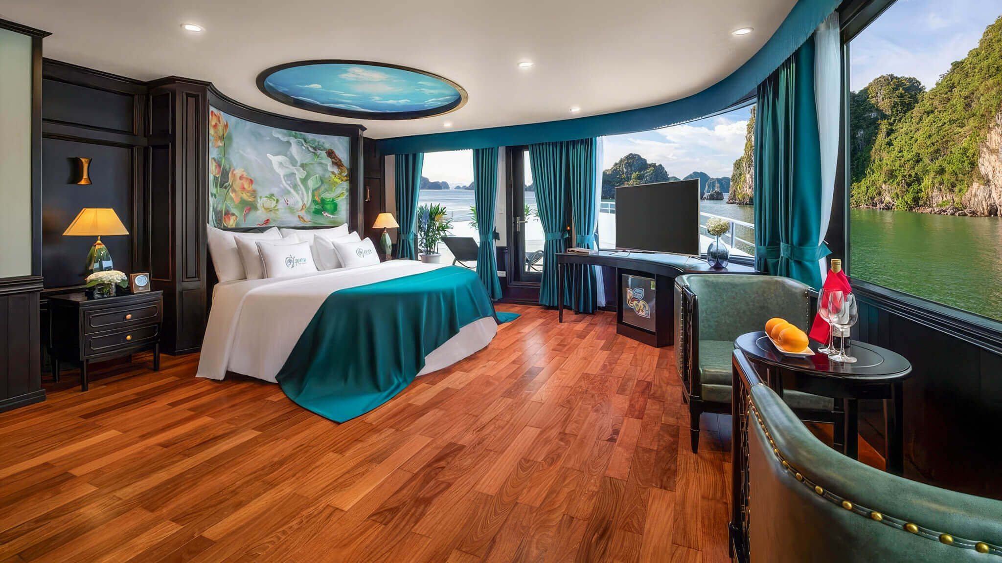 Aspira Cruise Presidential Suite bedroom and lounge area with bay view