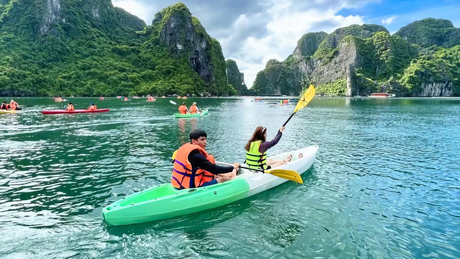 Catherine Cruise Halong Bay guests kayaking through Luon Cave