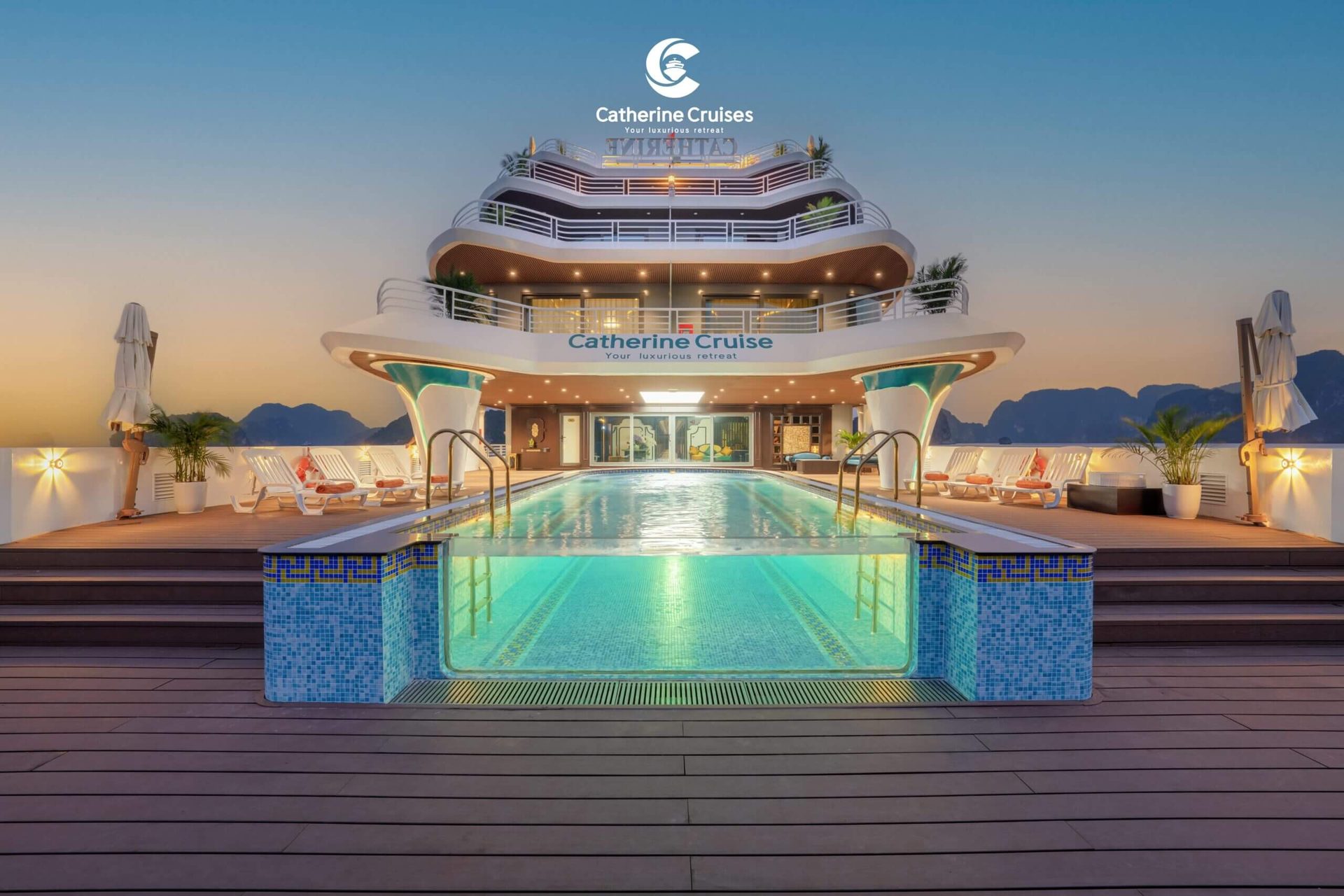 Catherine Cruise Halong Bay rooftop infinity pool lit up at dusk