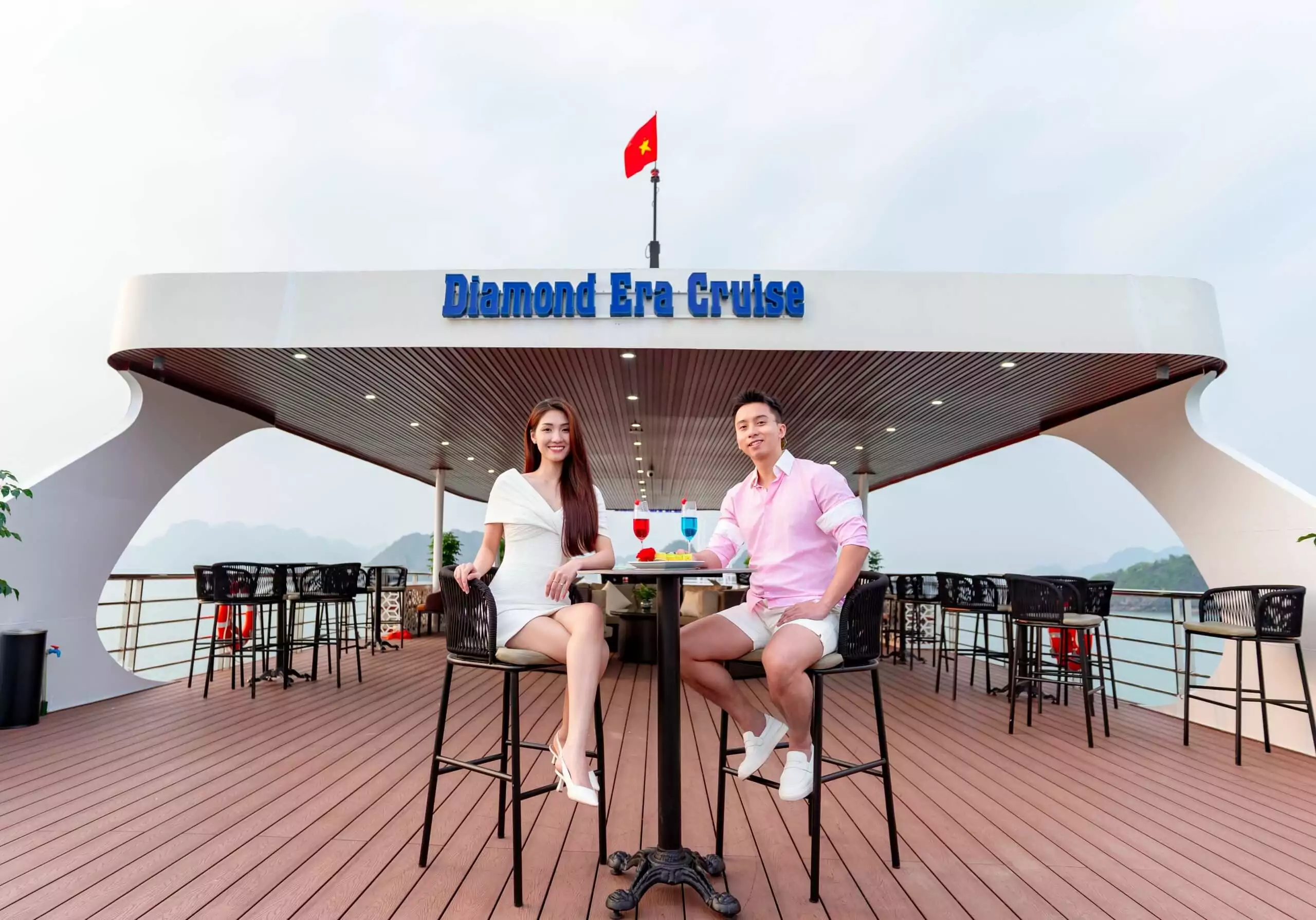 Guests enjoying welcome drinks at the sundeck bar aboard Diamond Era Cruise