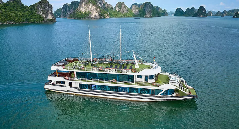 Aerial view of Halong Heritage Luxury Day Cruise sailing in Ha Long Bay
