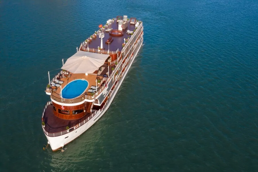 Aerial view of the outdoor swimming pool and sundeck layout on Heritage Binh Chuan Cruise.