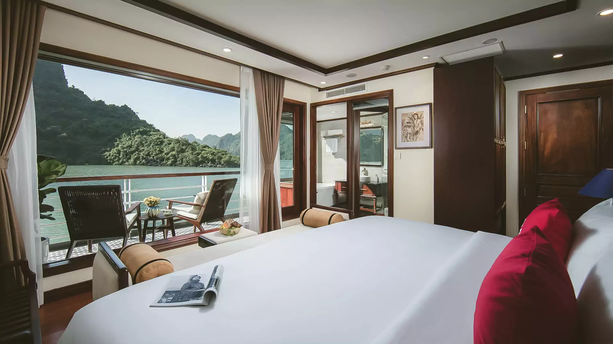 Delta Suite on Heritage Binh Chuan Cruise, decorated with 1930s Indochine-style furnishings.