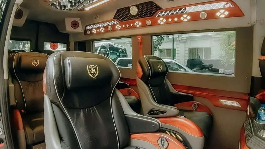 Spacious, reclining leather seats inside the Heritage Cruises limousine shuttle bus.