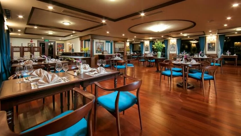 L'Indochine Restaurant on the 3rd deck of Heritage Binh Chuan Cruise, serving breakfast and lunch with bay views.