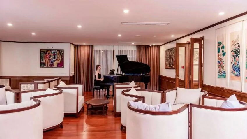 Live piano music at Song Hong Lounge, the indoor lounge on Heritage Binh Chuan Cruise.
