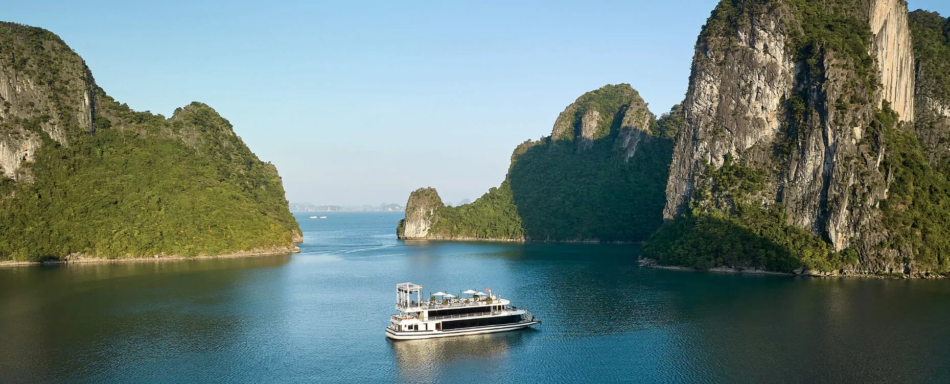 Iris Day Cruise Sailing Through Halong Bay's Limestone Cliffs
