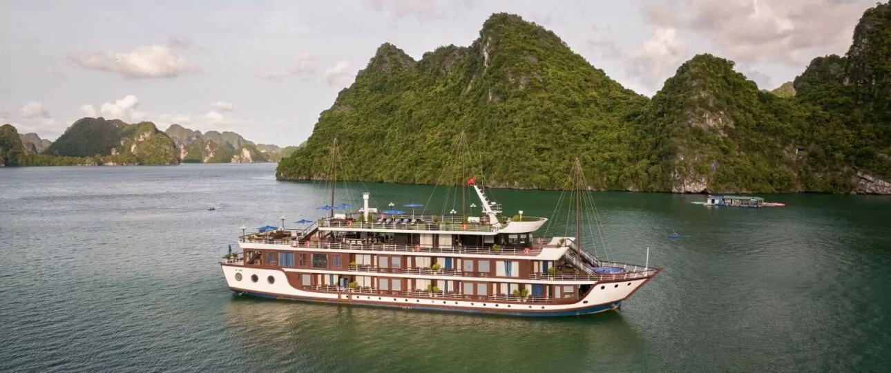 Le Journey Elegance Cruise sailing through Halong Bay and Lan Ha Bay limestone karsts