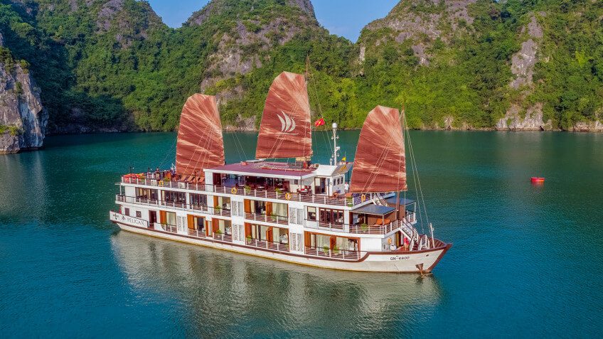 Milalux Cruise wooden junk boat with red sails cruising Halong Bay