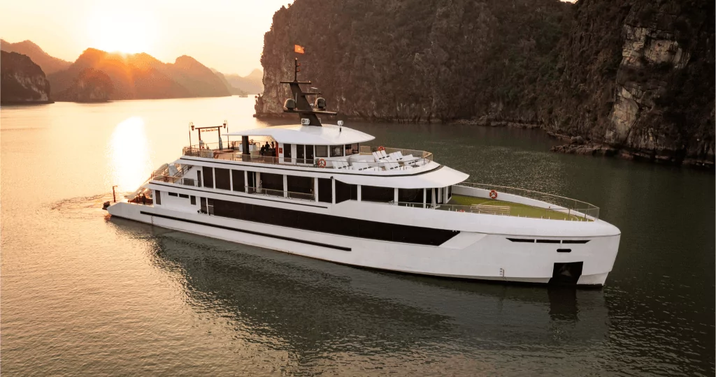 Hera Luxury Day Cruise Lan Ha Bay superyacht cruising at sunset