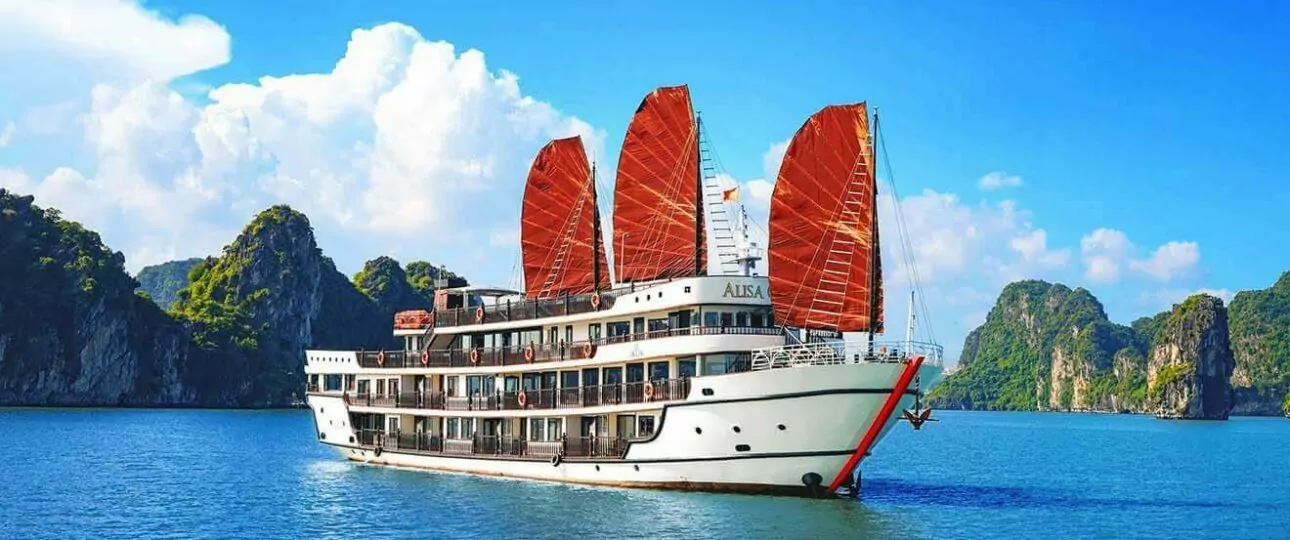 Alisa Premier Cruise sailing in Halong Bay with red sails