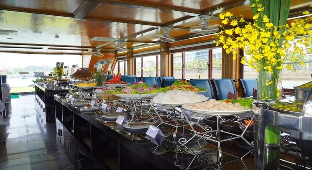 Buffet spread of Vietnamese dishes on board