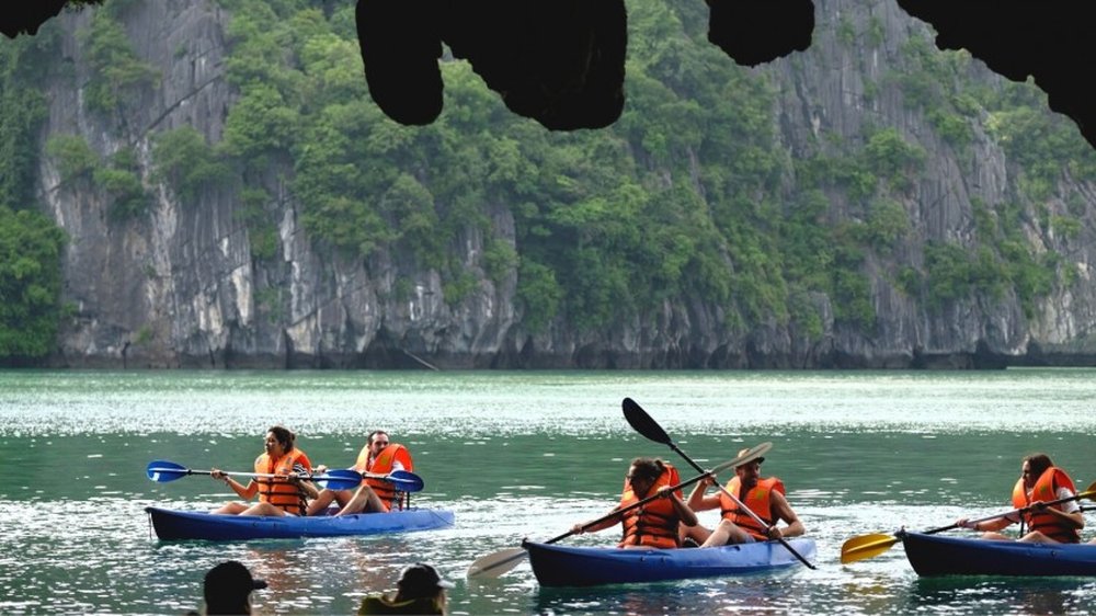 Guests kayaking near Luon Cave