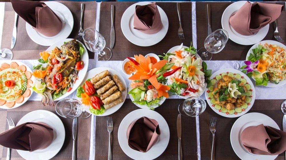 Overhead view of a Vietnamese lunch spread on board