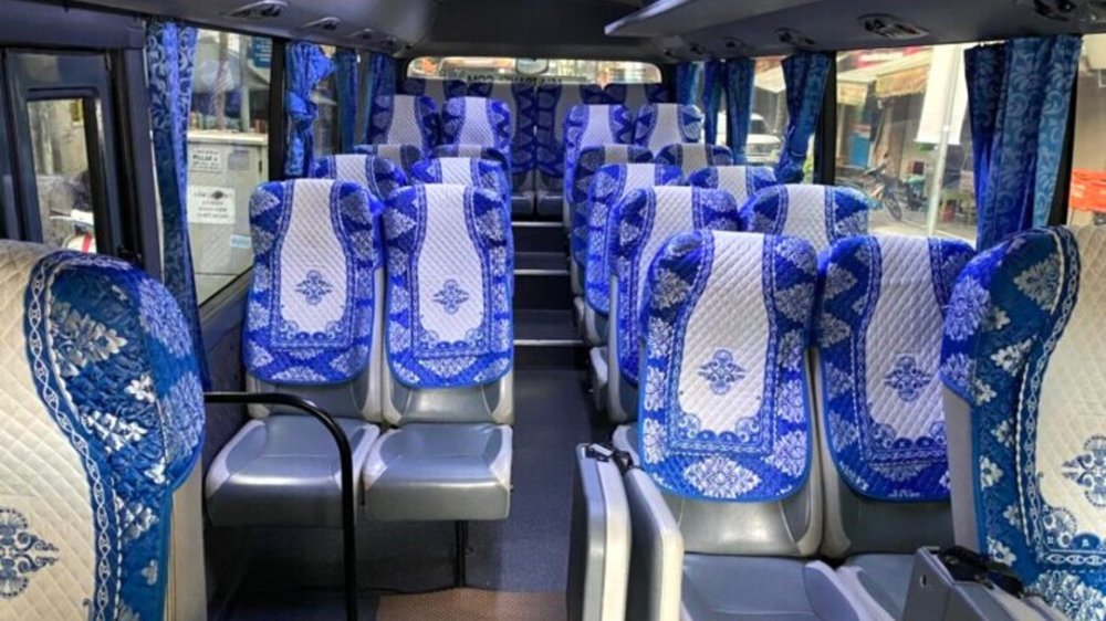 Comfortable shuttle bus interior for the Hanoi transfer