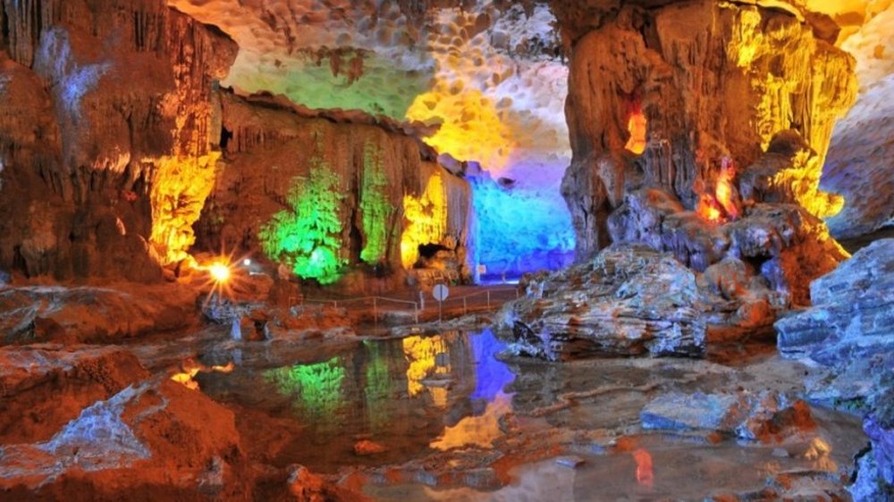 Colorfully lit stalactites inside Sung Sot Cave