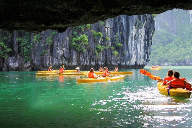 Kayaking near Luon Cave during the Ambrose Day Cruise Halong Bay tour