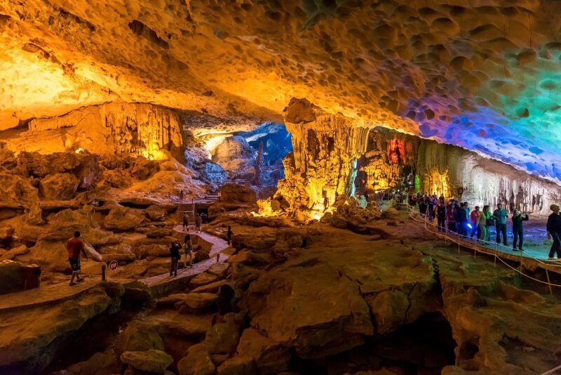 Guests exploring Sung Sot Cave during the Ambrose Day Cruise itinerary