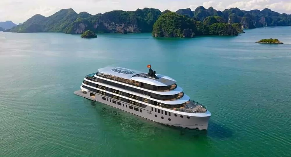 Orient Legacy Cruise sailing through Lan Ha Bay's limestone karsts, Halong Bay