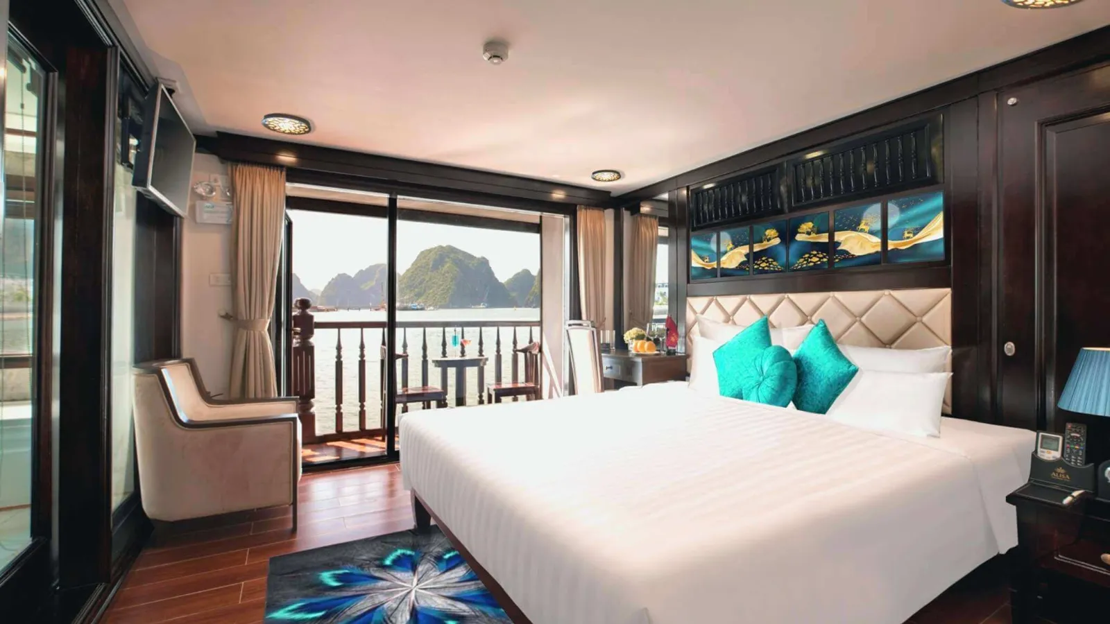 Junior Suite bedroom with private balcony and Halong Bay view